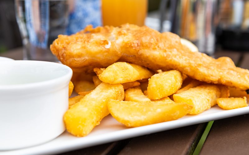 Traditional English Food such as Fish and Chips with green mushy peas served in the Pub or Restaurant